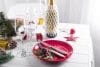 Beautiful red Christmas table setting with decorations on table